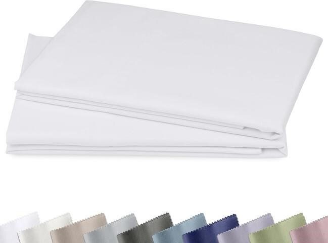 Folded white king-size cotton pillow cases with color swatch samples on white background